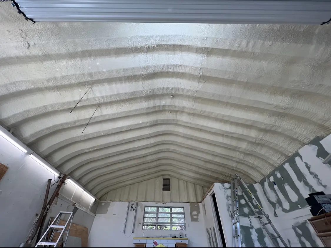 Spray polyurethane foam applied to the underside of a metal roof deck in Willow Oak